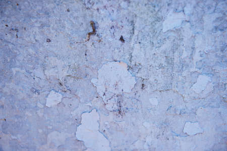 Grey wall with dabs of putty or paint.Texture or background