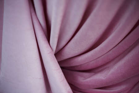 pink velvet fabric with drape.Texture. Delicate colorの写真素材