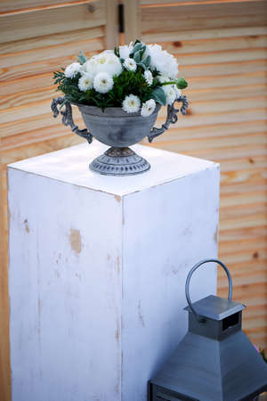 Wedding decor. Floral arrangement with berries white. Flowers.Old metal lanternの写真素材