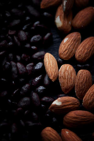 Almonds and sunflower seeds in chocolate on a dark background.Studio.の写真素材