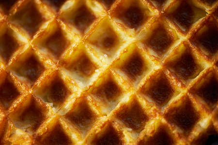 The texture is lush fresh Belgian waffles.Close