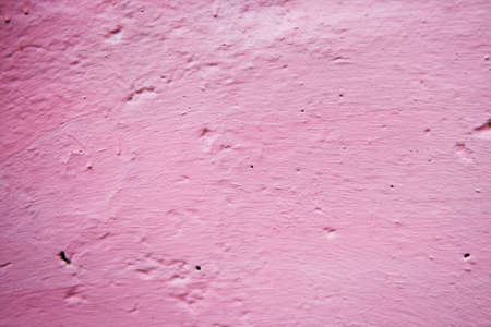 Grunge Background. Wall with the colored turquoise whitewash falling off fragment as a background textureの写真素材