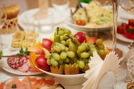 Fruits wedding table grapes, kiwi, pears  Beatiful mealの写真素材