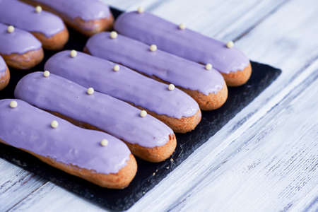 Eclairs, filled with purple frosting.A work of culinary art
