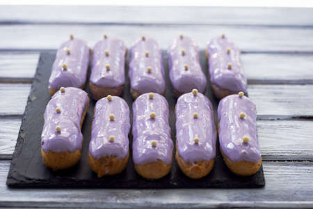 Eclairs, filled with purple frosting.A work of culinary art