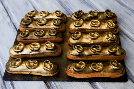 Eclairs, filled with Golden glaze. a work of culinary art