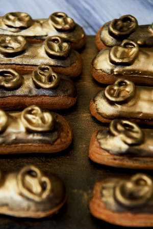 Eclairs, filled with Golden glaze. a work of culinary art