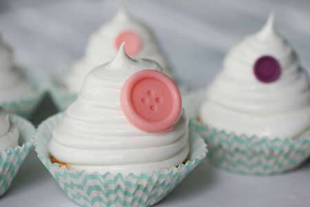 Basket of cream in a paper wrapper.Culinary syringe. beautiful cream hat decorated with buttons
