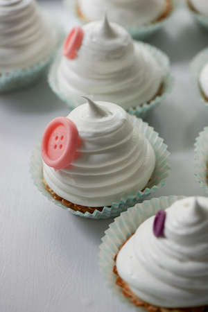 Basket of cream in a paper wrapper.Culinary syringe. beautiful cream hat decorated with buttons