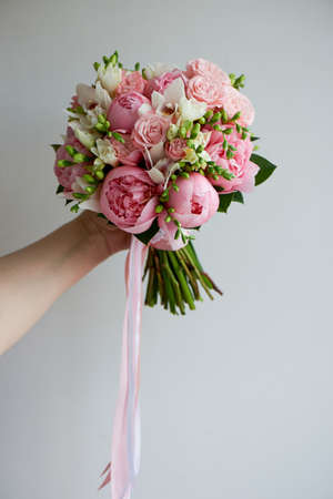 The brides bouquet of soft pink peonies and white roses . Wedding floristry. Classic formの写真素材