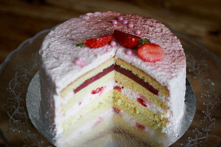 Strawberry yogurt cake.s Consists of butter sponge cakes,covered with cream-based live strawberry yoghurt. Filling : fresh strawberries and strawberry confit. Insanely light and delicate cake.の写真素材