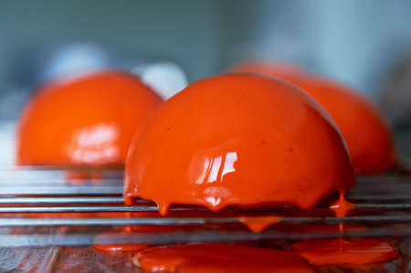 massovoe cake with mirror glaze.A work of culinary art. The process of casting.の写真素材