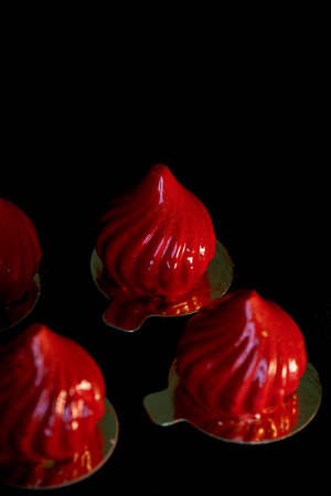 Fire berry cake, A delicate cream mousse, covered with incredibly shiny mirror-like glaze on the condensed milk, hides inside serdtsevinka of lemon jelly and ganache is incredibly useful oblepiha. Based cupcake crunchy almond-coconut decoys with hints of の写真素材