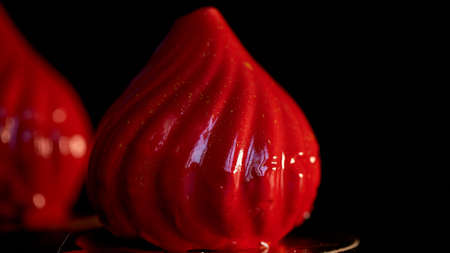 Fire berry cake, A delicate cream mousse, covered with incredibly shiny mirror-like glaze on the condensed milk, hides inside serdtsevinka of lemon jelly and ganache is incredibly useful oblepiha. Based cupcake crunchy almond-coconut decoys with hints of の写真素材