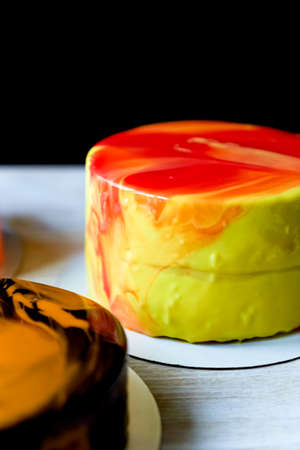 The process of casting the mirror glaze on a cake round session. Mousse. Yellowの写真素材