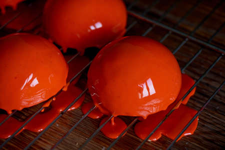 massovoe cake with mirror glaze.A work of culinary art. The process of casting.の写真素材