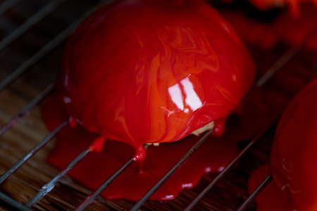massovoe cake with mirror glaze.A work of culinary art. The process of casting.の写真素材