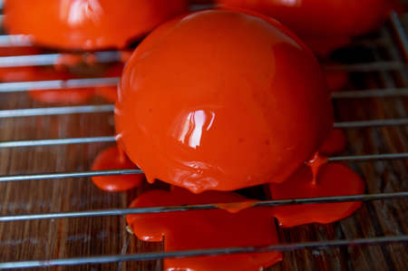 massovoe cake with mirror glaze.A work of culinary art. The process of casting.の写真素材