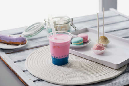 bubble tea in pink and blue color in a plastic Cup with a straw. Soft, beautiful colorsの写真素材