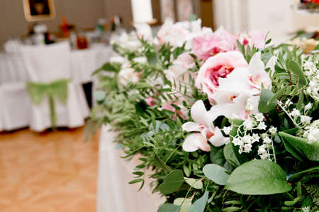 Wedding table decoration newlyweds. Songs on the table of flowers.The pink and white palette, rose, Orchidの写真素材