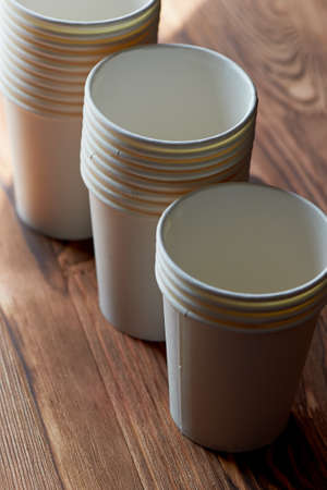 White disposable paper cups for coffee and tea. A lot.の写真素材