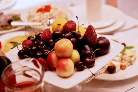 Fruit plate on the table of the newlyweds.Wedding decorationの写真素材