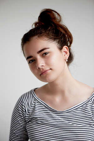 Portrait of young beautiful girl with brown eyes and black hair.Natural beauty, with clean glowing skin.の写真素材