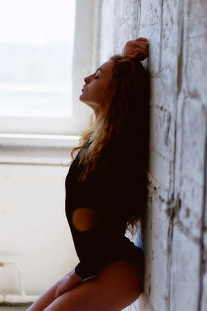 Model tests. Beautiful redhead girl with curly hair. Natural color. Demonstrates the flexibility for...