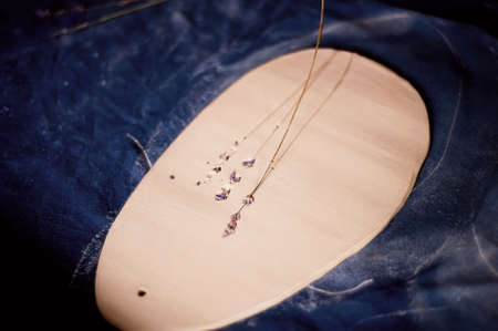 Creative workshop of ceramist. The imprint of grass on clay. Technique printed pattern. Workflowの写真素材