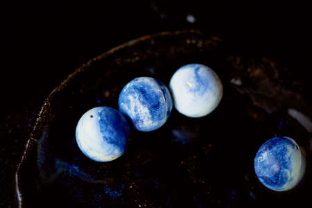 Space gradient candy white chocolate on a dark surface. The art of the chocolatierの写真素材