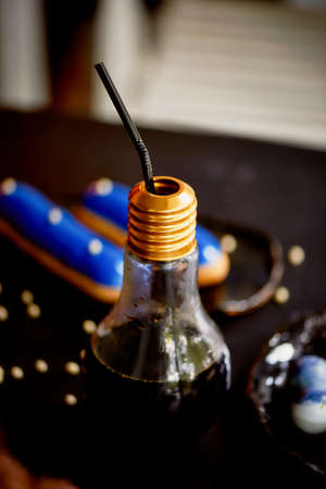 coffee Cup shaped bulb lighting. The dark background