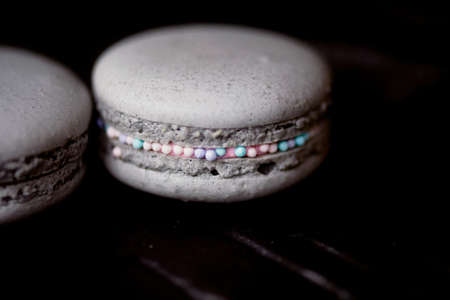 The photo in the dark gray scheme. Grey cake macaron. Macroの写真素材
