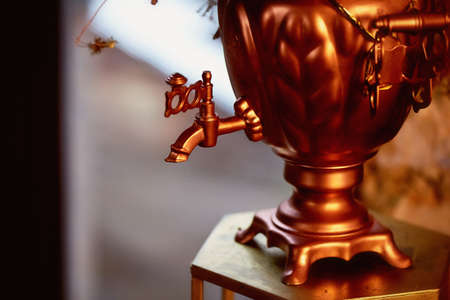 Old copper samovar. Focus on the tap. Macro retroの写真素材