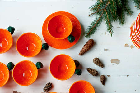 The color of the sun.Warmth. Bright orange dishes in the style of a Mandarin or orange. Ceramicsの写真素材