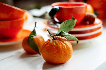 The color of the sun.Warmth. Bright orange dishes in the style of a Mandarin or orange. Ceramicsの写真素材