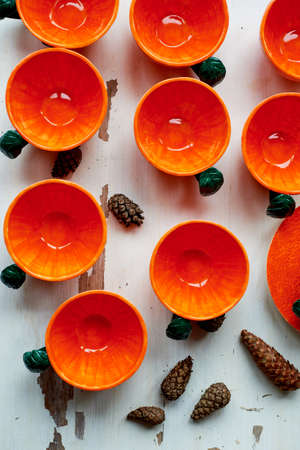 The color of the sun.Warmth. Bright orange dishes in the style of a Mandarin or orange. Ceramicsの写真素材
