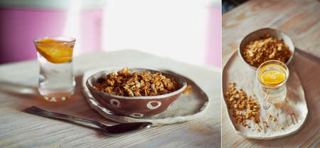 Healthy Breakfast of Champions. Muesli , a glass of water with a slice of orange. Ceramic handmadeの写真素材