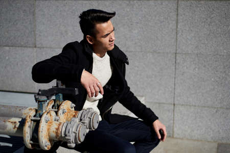 A young man, thin. With dark hair and brown eyes. Portrait. The model of attractive appearance. The...