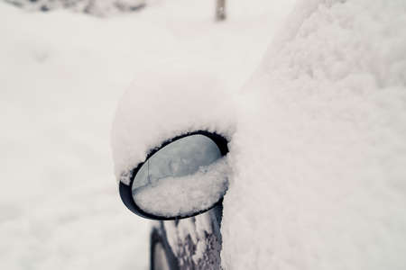 The car, covered with snow. Heavy snowfall, precipitation. The problem of motoristsの写真素材