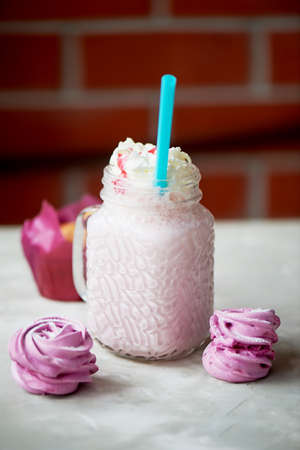 Pastel picture. Delicious dessert in pink tones. Marshmallow and milk strawberry cocktailの写真素材