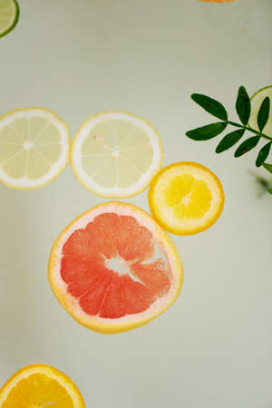 Milk water in the bath, which swim citrus: lime, lemon and grapefruit. Skin care and relaxationの写真素材