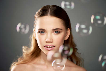 Portrait of young beautiful girl in Studio, with professional makeup. Beauty shooting. The beauty of...