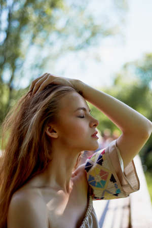 Portrait of a red-haired girl with long hair. Hair down. Artistic portrait. Child of nature....