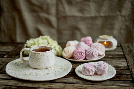 Delicate pastel colors. Tea party in the open air. Ceramics in a rustic style, handmade. Delicate...