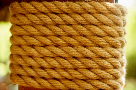 Decorative element. A thick wooden beam wrapped with rope