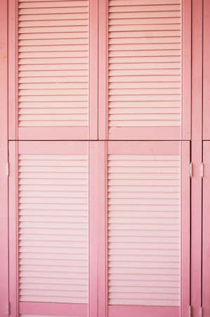 Texture pink doors blinds made of wood. Decorative elementの写真素材