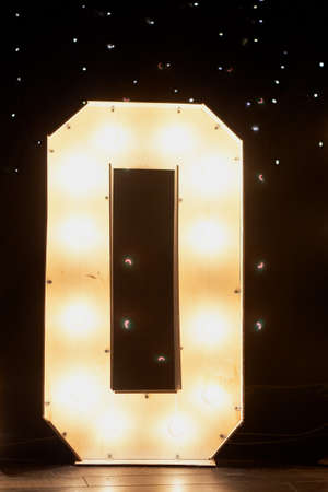 Glowing letters o in the design of a party or night club.の写真素材