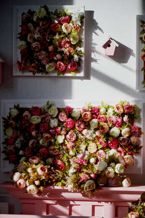 a screen decorated with pink flowers. Holiday photo zone decorの写真素材