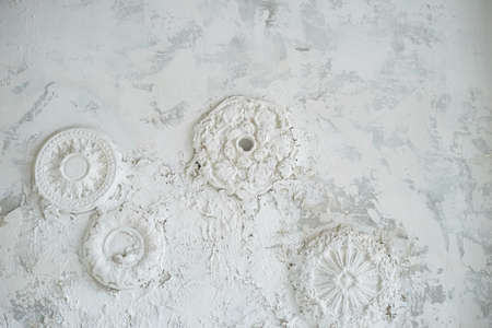 Stucco on a white wall with old plaster. Textureの写真素材