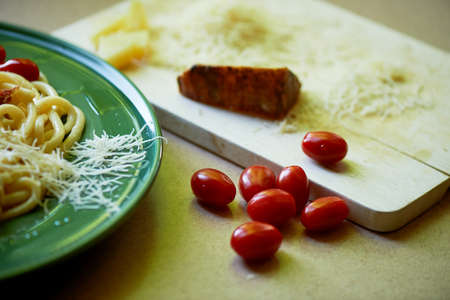 Pasta Carbonara with grated Parmesan cheese and cherry tomatoes, decorated with arugula. Italian...
